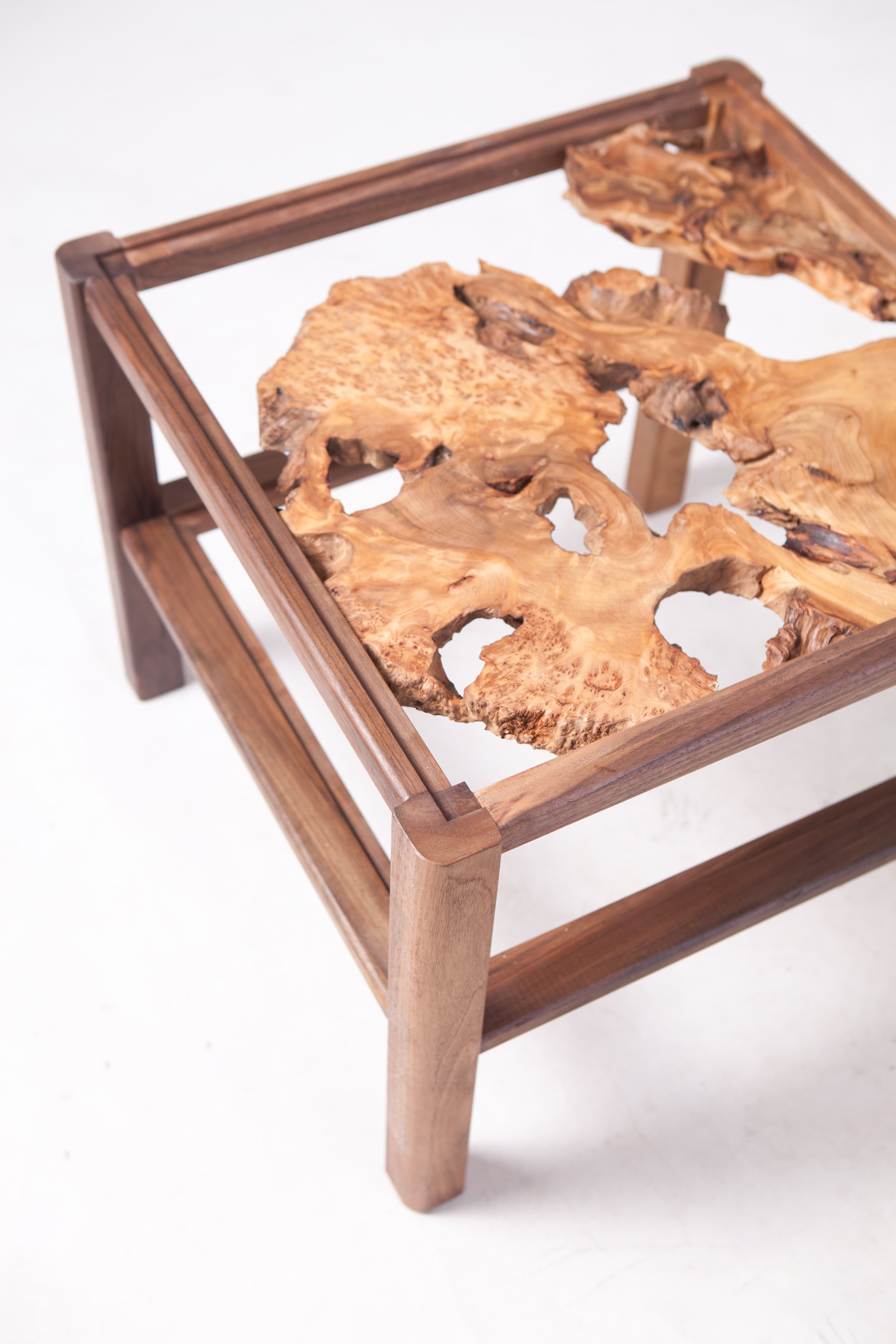 Close view of Product 03's natural wooden form within its frame.